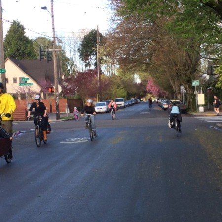 Picture of bicyclists riding on bike boulevard through an intersection